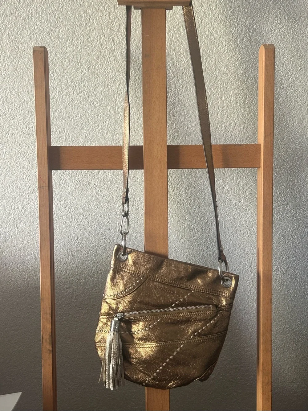 b. makowsky Metallic Gold Crossbody with Tassel Accent
